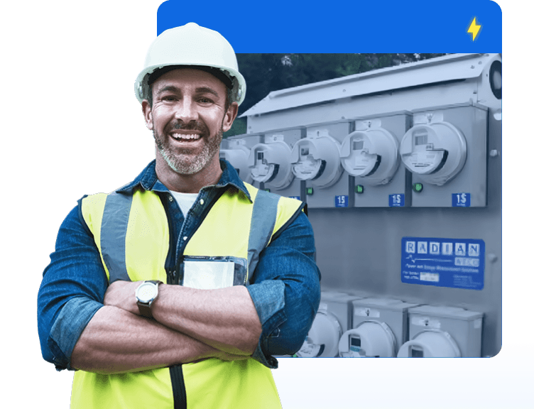 A meter farm behind a smiling man in a hard hat.