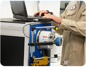 A meter technician using a WECO Test Board in a meter shop.