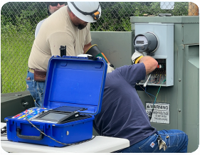 A team of meter technicians using the RW-30X in the field on a meter.