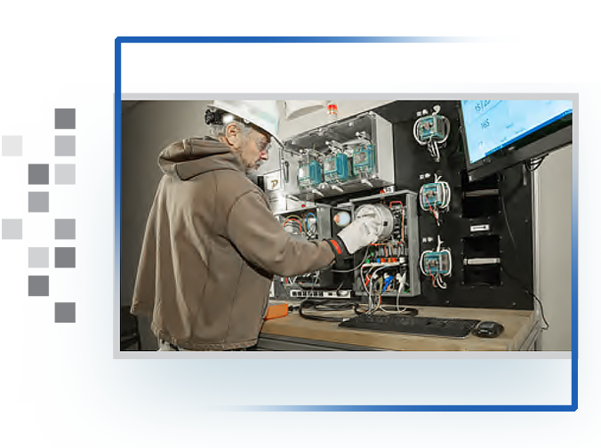 A utility technician testing a meter on the Powermetrix 8803A.