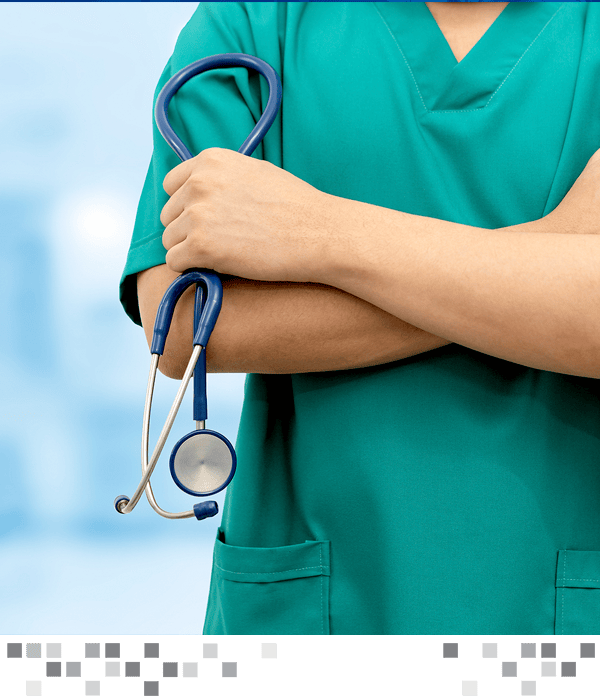 A medical professional with their arms crossed holding a stethoscope